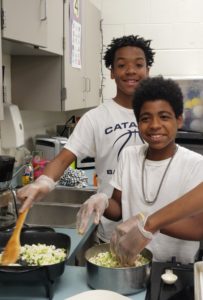 teenage boys cooking