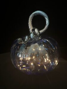 Glass pumpkin with string lights inside